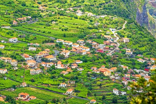 Village / town Arco de Sao Jorge, Madeira - typical madeiran landscape, residential houses with orange roofs sourrounded by green terraced nature