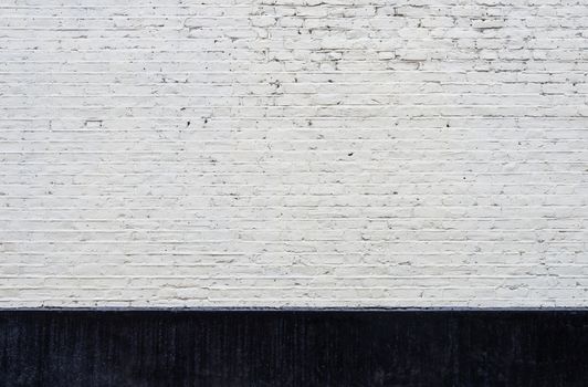 White brick wall and black skirting texture