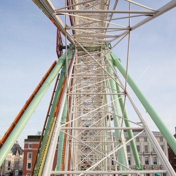 Old ferris wheel over a blue sky