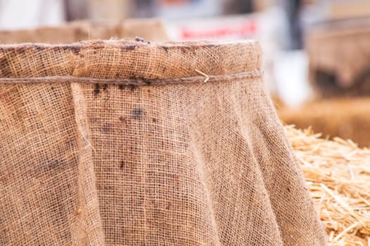 wooden barrel near the straw on the snow