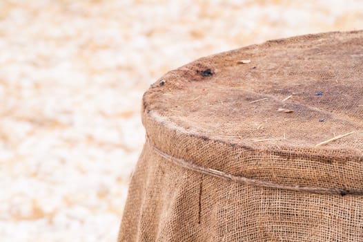 wooden barrel near the straw on the snow