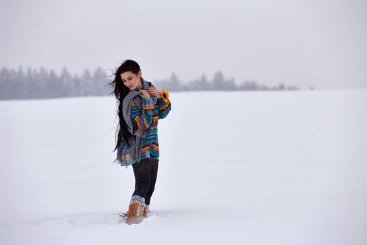 Beautiful girl in a sweater on a winter walk, Belarus