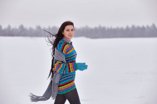 Beautiful girl in a sweater on a winter walk, Belarus