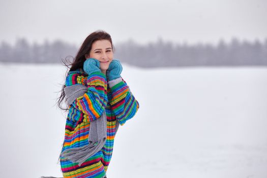 Beautiful girl in a sweater on a winter walk, Belarus