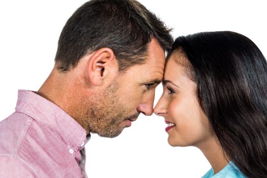 Smiling couple nose-to-nose on white screen