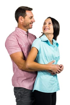 Smiling couple hugging and looking at each other on white screen