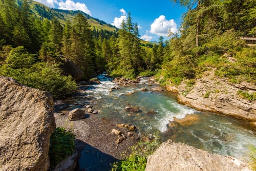 Alpine River in Switzerland. Swiss Alps Natural Landscape. Summer Scenery.