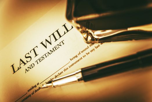 Last Will Concept Photo. Last Will Testament, Ink Bottle and Fountain Pen Concept.