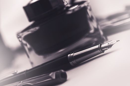 Fountain Pen and the Black Ink Bottle. Writing Concept.