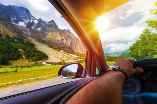 Mountains Summer Road Trip. Driving Along the Alps Mountains.