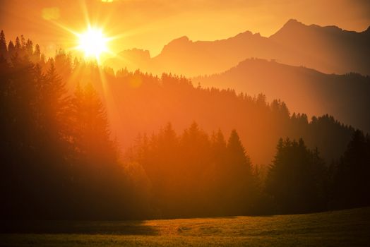 Scenic French Alps Sunset. Scenic Mountains Landscape. Hot Summer Sunset in European Alps.