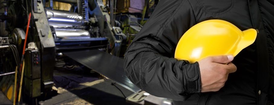 Worker with safety helmet at industrial factory