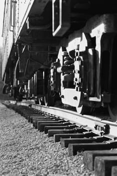 Black and white photo of the moving train and the road