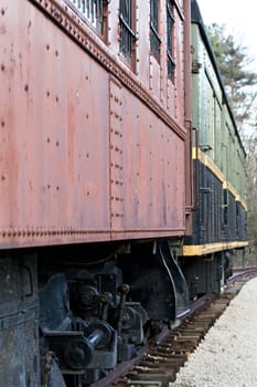 Image with the old wagons of the train on the road