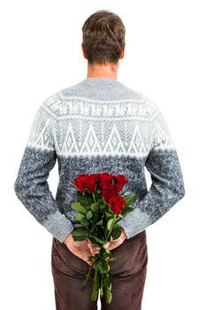 Rear view of man hiding red roses at back against white background