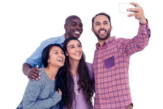 Happy multi-ethnic friends taking selfie while standing against white background