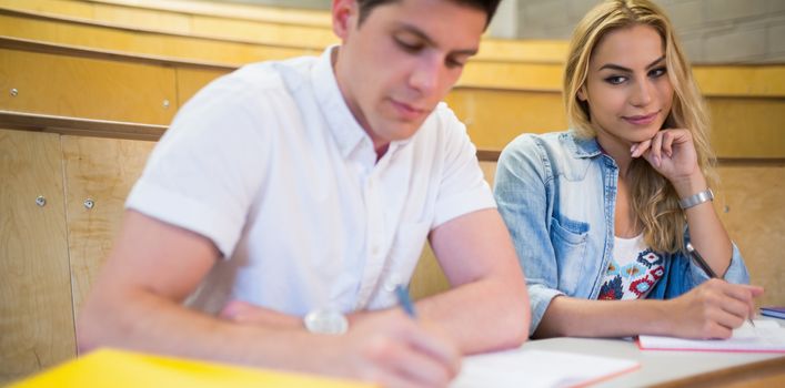 Female student cheating on her classmate at the university 