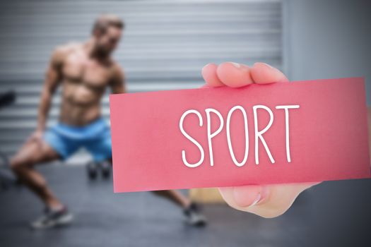 The word sport and hand showing card against 
