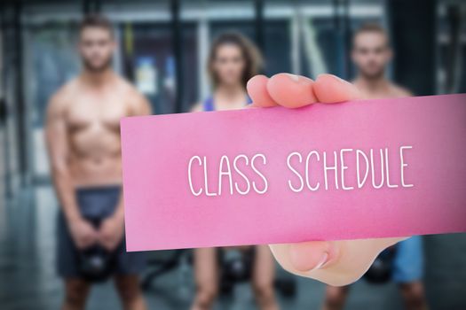 The word class schedule and young woman holding blank card against 