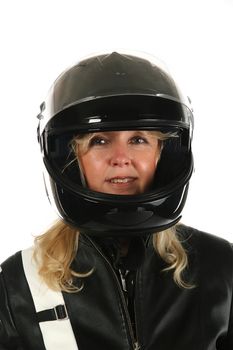 Woman motorcyclist in front of white background.