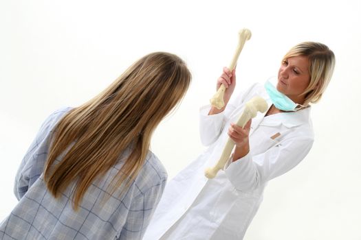 Doctor showing pacient how she has broken her bones