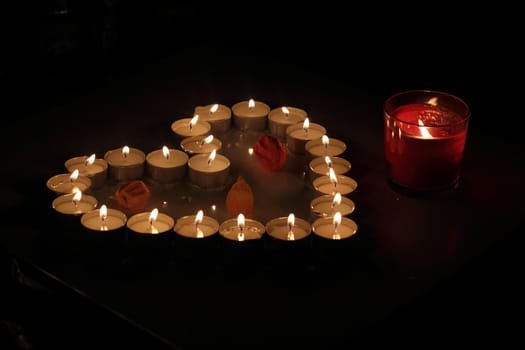 Heart of candles, a sign of love. romantic evening