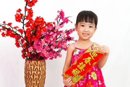 Chinese little girl pising holding  Spring festival couplets greeting for Chinese New Year in isolated white background.