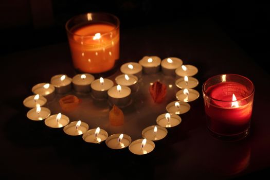 Heart of candles, a sign of love. romantic evening