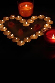 Heart of candles, a sign of love. romantic evening