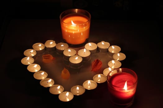 Heart of candles, a sign of love. romantic evening