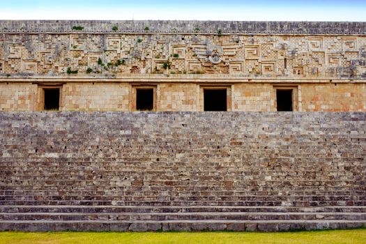 Detail view of ancient decorated wall and stairs in archeological site Uxmal, Mexico