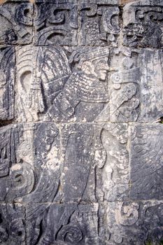 Detail of stone carvings in famous archeological site Chichen Itza, Mexico