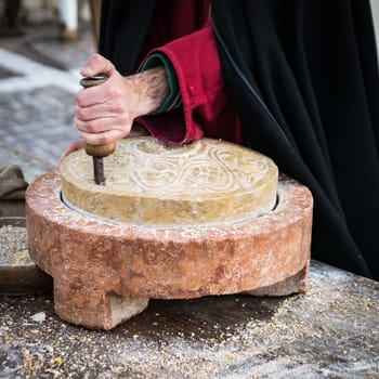 Ancient millstone that was turned by hand to produce flour and homemade bread.