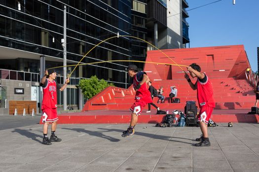 MELBOURNE/AUSTRALIA - JANUARY 22: Street performers entertaining crowds in Southbank during the 2016 Australian Open tennis tournament.