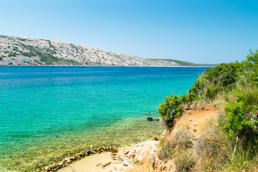 The crystal clear sea surrounding the island of Rab, Croatian tourist resort.
