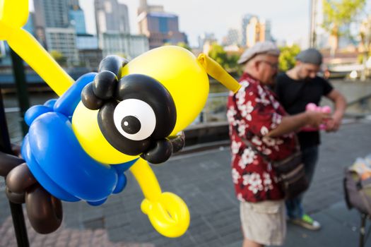 MELBOURNE/AUSTRALIA - JANUARY 22: Street performers creating Balloon Art creations in Southbank Melbourne during the 2016 Australian Open.