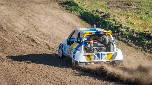 Car during a "stock car cross" race. The league called "stock car cross" foresees the use of tuned cars on unpaved circuits.