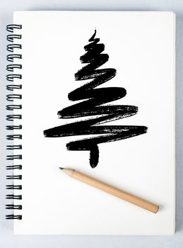 christmas tree hand draw on sketch book with pencli