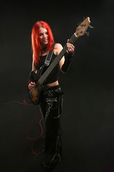 Teenage girl learning to play guitar
