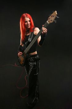 Teenage girl learning to play guitar