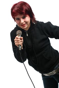 Teen girl singing with a microphone