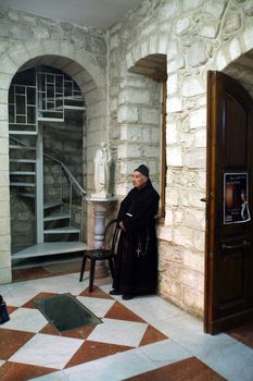 Franciscan monk in the Church of Jesus' first miracle. Franciscans in the Holy Land take care about most of the churches and shrines., Cana, Israel on December 30, 2007.
