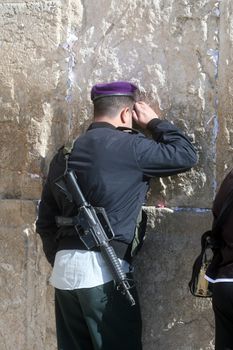 Jewish men pray at the western wall January 02, 2008 in Jerusalem, IL. The wall is one of the holiest sites in Judaism attracting thousands of worshipers daily.
