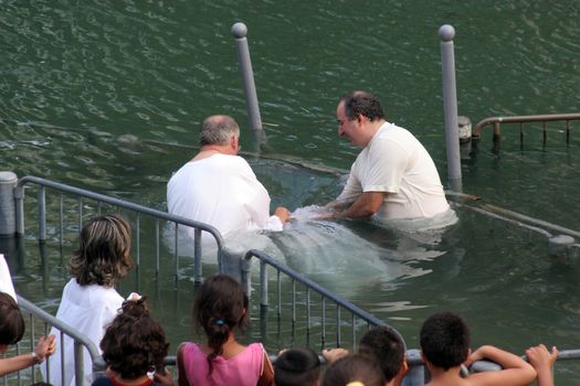 Baptismal site at Jordan river shore. Baptism of pilgrims  in Yardenit, Israel on September 30, 2006.