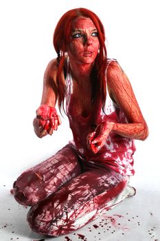 Beautiful red hair girl covered in blood