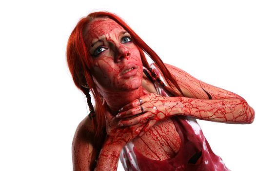 Beautiful red hair girl covered in blood