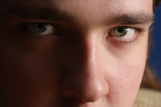 Close-up portrait of a young man looking at the camera