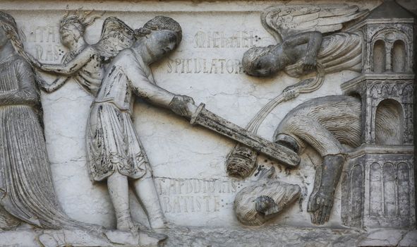 Beheading of St. John the Baptist, detail of marble carvings on the Baptistery, Parma Emilia-Romagna Italy