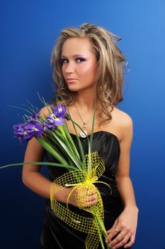 Beautiful girl smelling roses
