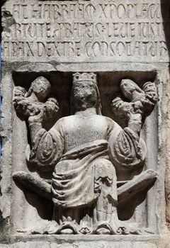 Faith (holding Justice and Peace) relief at the baptistry from Parma, Emilia Romagna, Italy